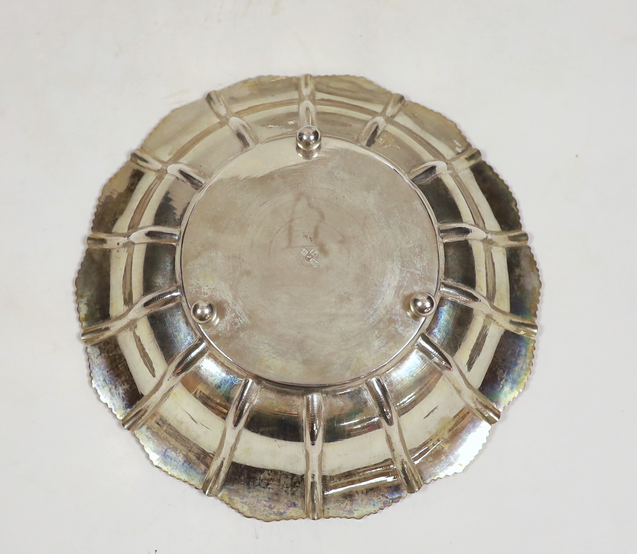 A Persian engraved white metal (stamped 84) fruit bowl, diameter 23cm and a similar pierced dish, 34.4oz.